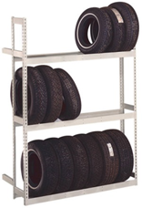 Title: Tire Storage Rack - Description: Tire storage rack with 3 metal shelves holding tires.